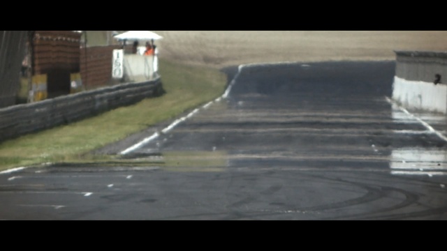 Video Reference N18: Asphalt, Mode of transport, Road surface, Race track, Drifting, Road, Vehicle, Lane, World rally championship, Sport venue