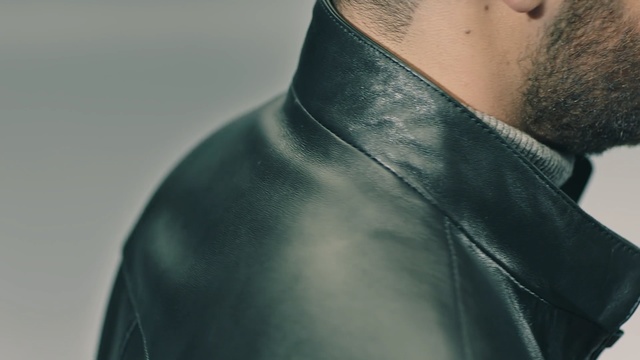 Video Reference N10: neck, shoulder, textile, outerwear, jacket, leather, top, sleeve