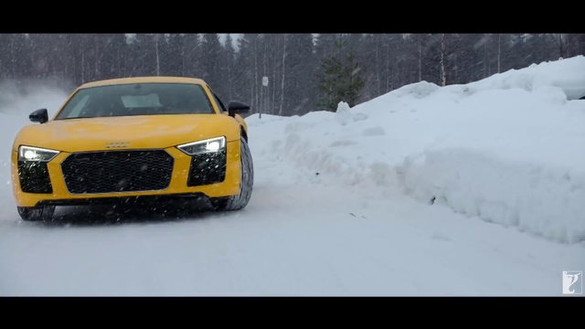 Video Reference N18: Land vehicle, Vehicle, Car, Snow, Yellow, Automotive design, Audi, Grille, Luxury vehicle, Mid-size car