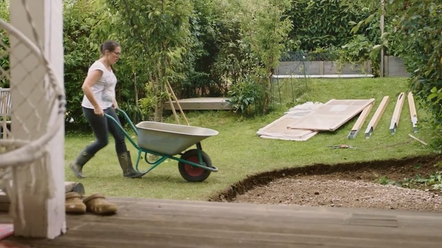 Video Reference N4: Wheelbarrow, Cart, Grass, Yard, Vehicle, Backyard, Leisure, Table, Soil, Tree