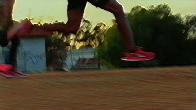 Video Reference N1: red, footwear, skateboarder, skateboard, mode of transport, skateboarding equipment and supplies, fun, longboard, recreation, longboarding, Person