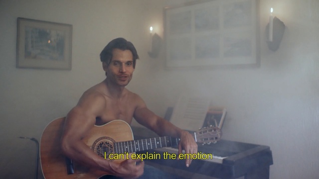Video Reference N1: Barechested, String instrument, Male, Musical instrument, Plucked string instruments, Guitar, Muscle, Room, Musician, String instrument, Person