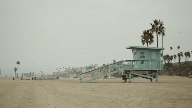 Video Reference N3: beach, sand, mode of transport, boardwalk, sky, shore, vacation, walkway, sea, horizon