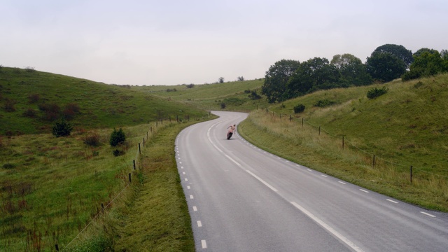 Video Reference N1: Road, Thoroughfare, Lane, Highland, Infrastructure, Asphalt, Grassland, Highway, Hill, Pasture