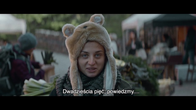 Video Reference N1: Screenshot, Adaptation, Human, Fur, Headgear, Photo caption, Photography, Movie, Happy, Smile, Photo, Looking, Man, Front, Standing, Wearing, Head, Green, Large, Face, Hat, Brown, Close, Cake, White, Holding, Street, Board, Sign, Horse, Bear, Blue, Riding, Train, City, Human face, Text, Person, Clothing, Girl