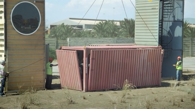 Video Reference N1: shed, wall, shipping container, roof, facade, outdoor structure, wood, shack, garden buildings, siding