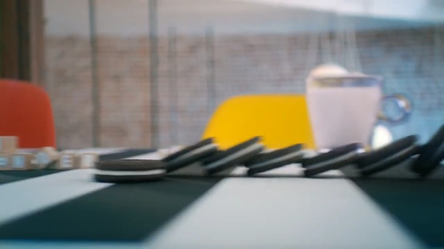Video Reference N3: yellow, technology, table, material, glass, furniture, Person