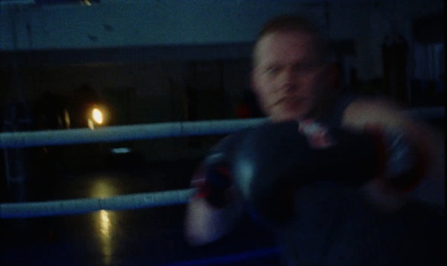 Video Reference N1: Boxing ring, Black, Sport venue, Blue, Light, Darkness, Lighting, Night, Mode of transport, Fun, Person