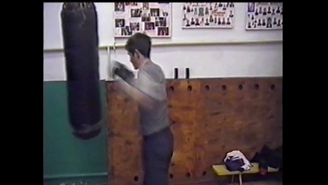 Video Reference N0: Photograph, Punching bag, Standing, Arm, Snapshot, Wall, Room, Shoulder, Leg, Font