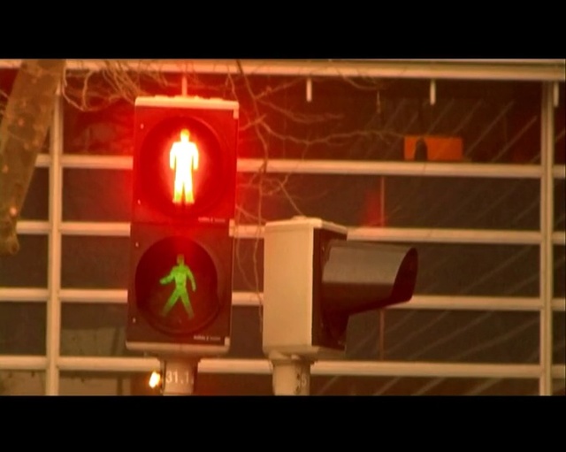 Video Reference N0: red, traffic light, light fixture, signaling device, lighting, light, darkness, technology, midnight, heat, Person