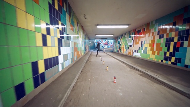 Video Reference N7: infrastructure, wall, subway, metropolitan area, road, art, leisure centre, mural, daylighting, Person
