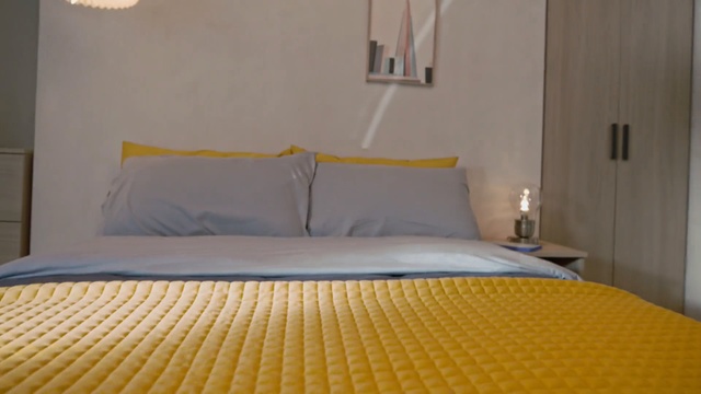 Video Reference N0: bedroom, room, property, yellow, bed frame, bed, bed sheet, suite, duvet cover, floor