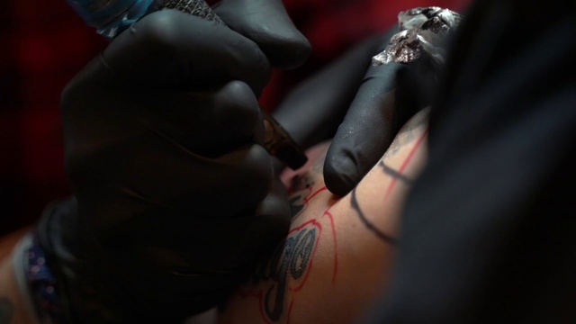 Video Reference N8: Tattoo, Skin, Hand, Flesh, Finger, Tattoo artist, Lip, Pain, Design, Mouth