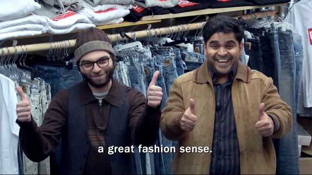 Video Reference N1: man, market, men, glasses, smile, pants, thumbs up  , Person