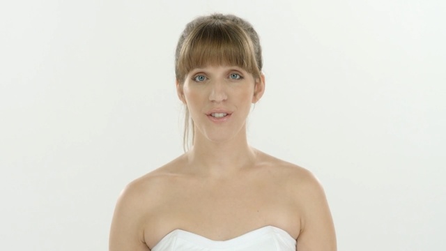 Video Reference N2: skin, beauty, shoulder, standing, chin, hairstyle, neck, girl, arm, gown, Person