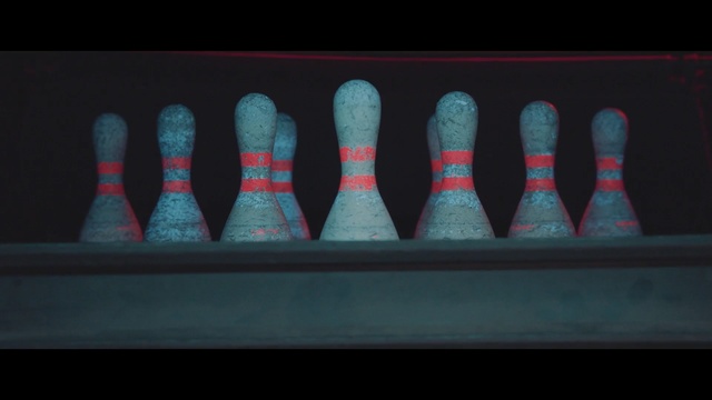 Video Reference N1: bowling pin, red, bowling equipment, darkness, midnight, duckpin bowling, Person
