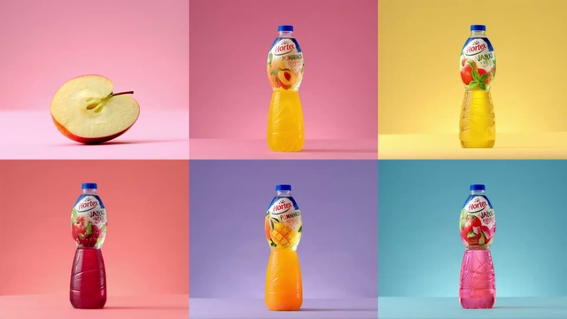 Video Reference N1: Orange, Bottle, Plastic bottle, Non-alcoholic beverage, Orange soft drink, Orange drink, Drink, Soft drink, Glass bottle, Water bottle, Person, Indoor, Different, Photo, Table, Standing, Pink, Refrigerator, Colorful, Food, Dog, Water, Doughnut, Various, Sitting, Colored, Bedroom, Group, Computer, Desk, Many, Room, Hot, Man, Art, Toy