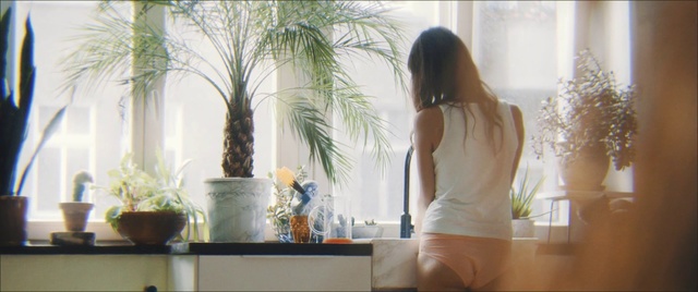 Video Reference N1: Beauty, Morning, Room, Sitting, Sunlight, Shoulder, Window, Dress, Leg, Interior design, Indoor, Person, Woman, Table, Looking, Front, Girl, Young, Standing, Living, Holding, Bed, Man, Glass, Desk, White, Television, Mirror, Vase, Red, Kitchen, Clothing, Houseplant