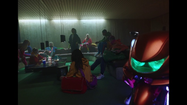 Video Reference N0: Fun, Room, Event, Indoor, Computer, Table, Sitting, Laptop, Desk, Holding, Light, Woman, Monitor, Lit, Keyboard, Playing, Dark, Phone, Girl, Using, Man, Screen, Green, Young, Standing, People, Video, Group, Red, Game, Wall, Person, Clothing