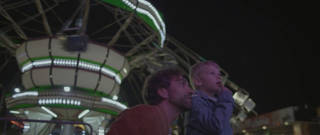 Video Reference N2: night, tourist attraction, amusement ride, fun, technology, recreation, darkness, event, Person