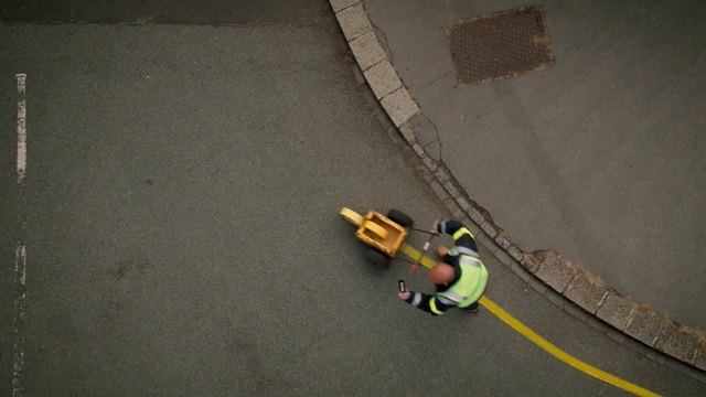 Video Reference N1: yellow, floor, asphalt, road surface, flooring, adventure, angle, concrete