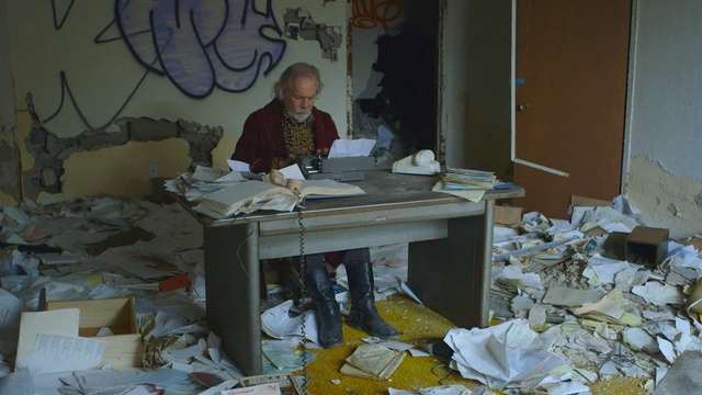 Video Reference N0: man, old man, office, graffiti, garbage, Person