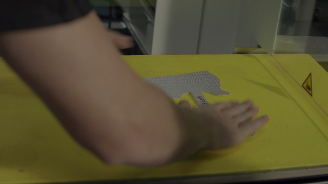 Video Reference N2: yellow, finger, leg, hand, arm, floor, material, design, foot, flooring