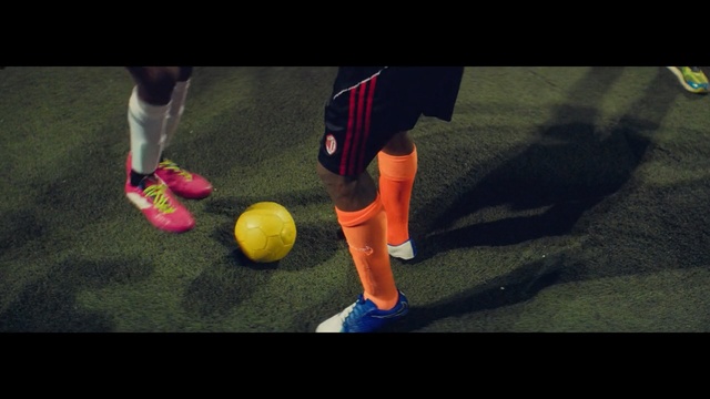 Video Reference N0: red, footwear, player, yellow, ball, shoe, football, grass, sports equipment, fun