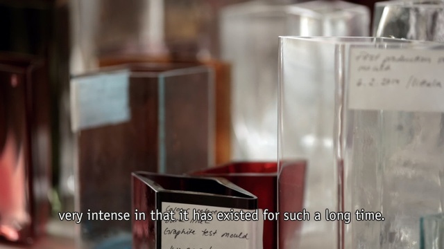 Video Reference N5: Product, Glass, Perfume, Material property, Font, Transparent material, Cosmetics, Glass bottle, Rectangle, Person, Person