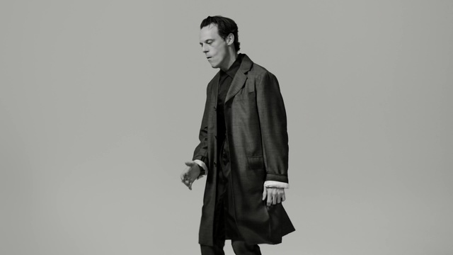 Video Reference N4: black and white, gentleman, standing, outerwear, monochrome photography, coat, monochrome, model, jacket, Person