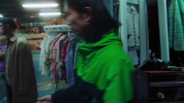 Video Reference N3: Green, Outerwear, Jacket, Room, Textile, T-shirt, Top, Sleeve