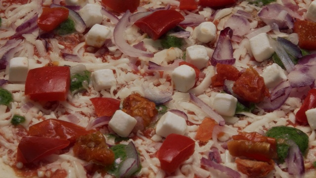 Video Reference N2: dish, pizza, cuisine, food, italian food, european food, pizza cheese, california style pizza, feta, vegetarian food, Person