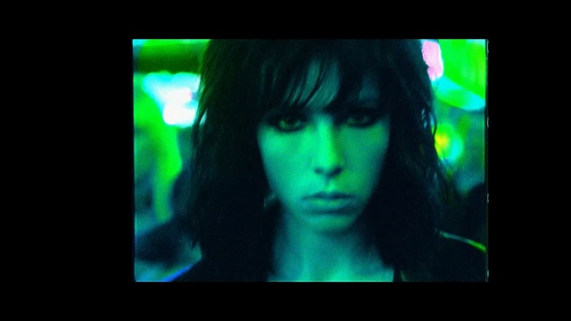 Video Reference N2: green, darkness, snapshot, black hair, mouth, girl, organ, display device, scene, midnight, Person