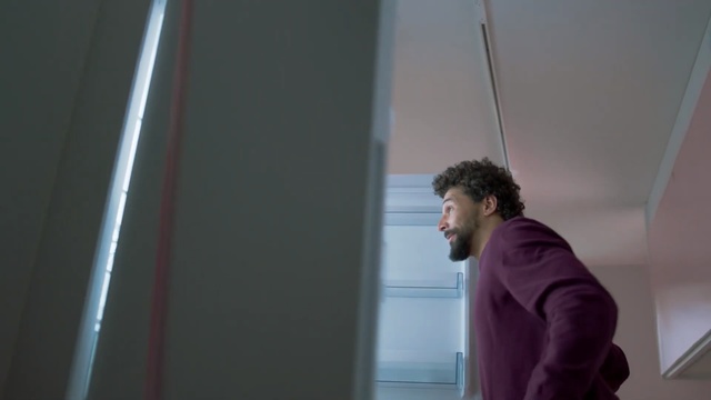 Video Reference N2: Standing, Window, Architecture, Photography, Smile, Glass, Ceiling, Person, Indoor, Man, Young, Front, Looking, Shirt, Holding, Woman, Computer, Girl, Water, Door, Room, Refrigerator, Kitchen, Television, White, Red, Blue, Remote, Playing, Wall, Clothing, Human face