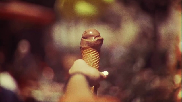 Video Reference N4: Microphone, Macro photography, Close-up, Photography, Hand, Finger, Audio equipment, Ice cream cone, Sitting, Food, Dessert, Ice cream, Blur