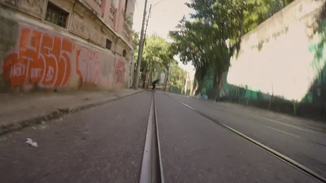 Video Reference N4: Road, Lane, Asphalt, Mode of transport, Thoroughfare, Street, Neighbourhood, Town, Wall, Road surface, Person