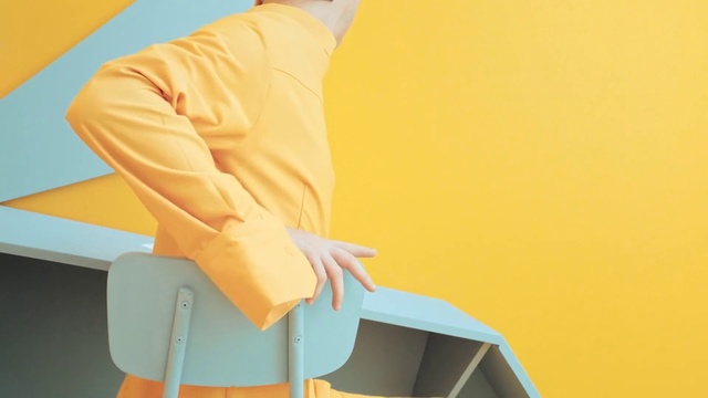 Video Reference N14: Yellow, Orange, Shoulder, Outerwear, Sleeve, Sitting, Illustration, Art