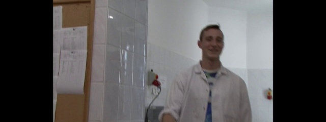 Video Reference N1: Wall, Tile, Floor, Flooring, Room, Plaster, Ceiling, Glass, Shower, Interior design, Person, Man, Indoor, Standing, Holding, Front, Photo, Mirror, Posing, Wearing, Looking, Camera, Suit, Shirt, Smiling, White, Black, Reflection, Dressed, Woman, Door, Young, Game, Kitchen, Bathroom, Human face, Clothing, Sink, Smile, Male