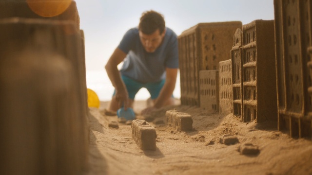 Video Reference N1: Sand, Building sand castles, Natural environment, Construction worker, Wall, Soil, Fun, Recreation, Bricklayer, Brick, Person