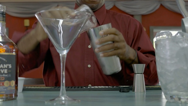 Video Reference N6: drink, wine glass, alcoholic beverage, stemware, cocktail, glass, liqueur, martini, drinkware, champagne stemware, Person