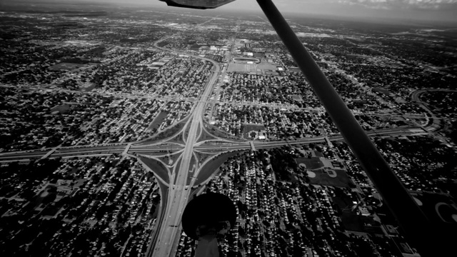 Video Reference N1: black and white, monochrome photography, sky, aerial photography, atmosphere, photography, metropolis, water, daytime, fixed link