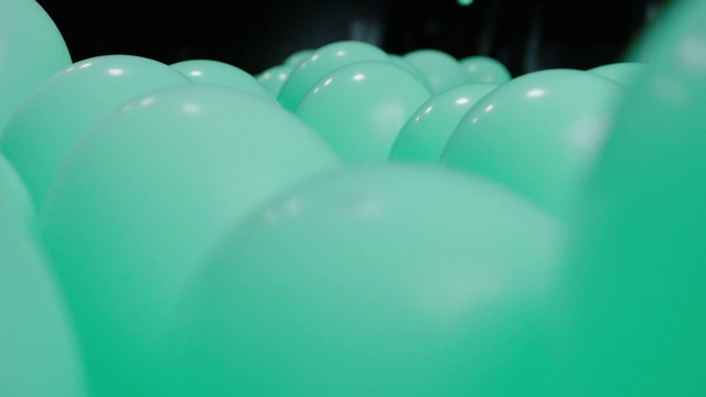Video Reference N0: Green, Blue, Turquoise, Balloon, Aqua, Teal, Party supply, Material property, Ball, Cup, Indoor, Sport, Sitting, Table, Bowl, Filled, Food, Glass, Close, White, Pink, Plate, Holding, Sink, Soup, Pool ball