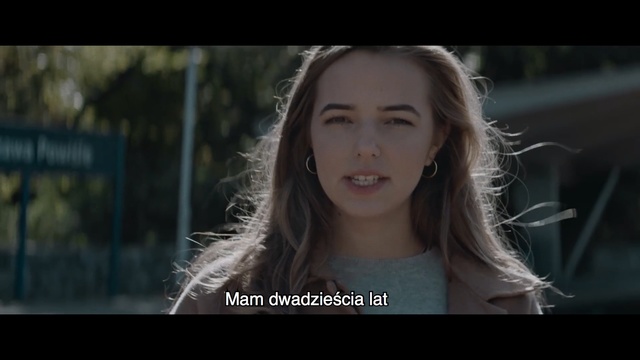 Video Reference N3: Hair, Face, Photograph, Facial expression, Lady, Beauty, Eyebrow, Nose, Snapshot, Chin, Person, Outdoor, Woman, Holding, Smiling, Girl, Young, Front, Standing, White, Little, Female, Shirt, Green, Street, Riding, Blue, Playing, Screenshot, Human face, Text, Portrait