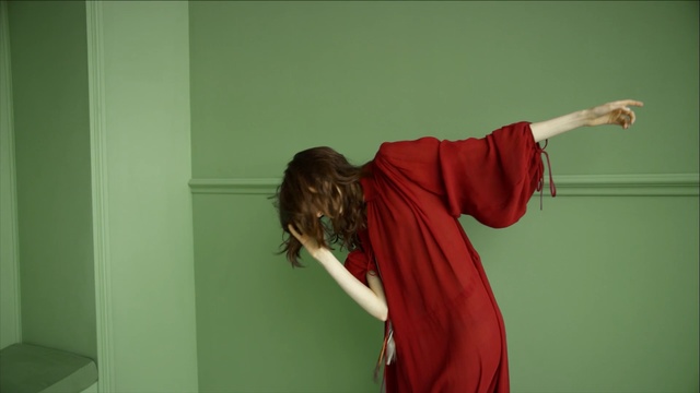 Video Reference N2: Shoulder, Red, Green, Arm, Joint, Standing, Wall, Room, Outerwear, Textile