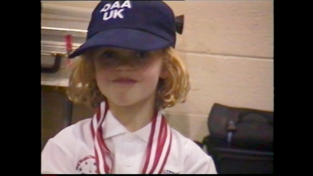 Video Reference N2: clothing, hair, facial expression, human hair color, fashion accessory, cap, headgear, head, blond, girl, Person