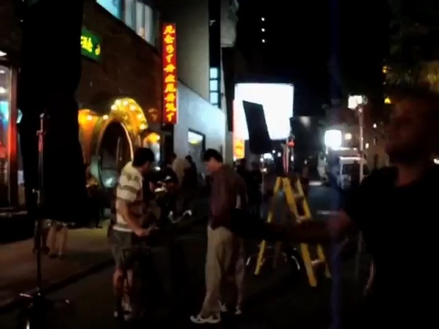 Video Reference N2: crowd, people, mode of transport, event, night, lighting, fun, darkness, pedestrian, recreation, Person