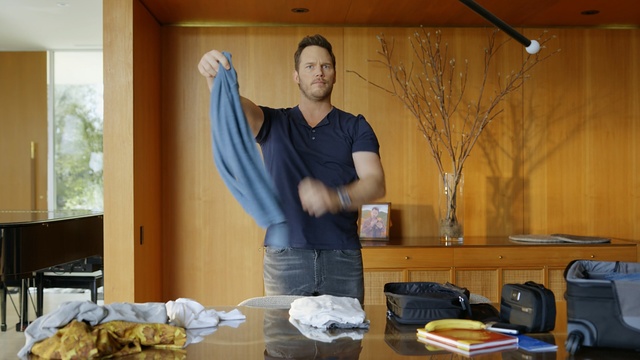 Video Reference N1: house, home, man, sexy man, t shirt, blue, brown, wood, table, Person