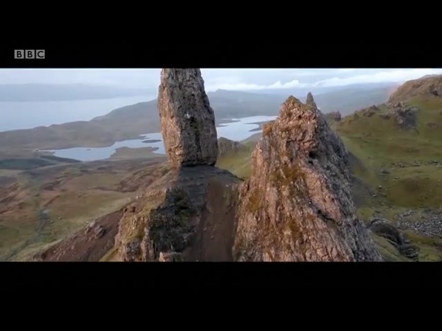 Video Reference N2: rock, badlands, wilderness, mountain, ridge, highland, geological phenomenon, escarpment, sky, cliff