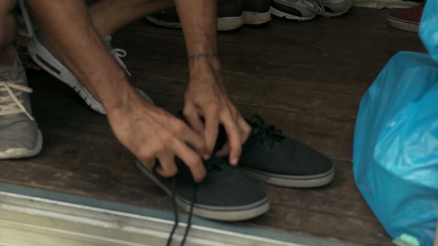 Video Reference N1: footwear, blue, leg, foot, shoe, floor, human leg, hand, finger, flooring