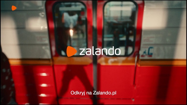 Video Reference N1: Red, Transport, Public transport, Font, Telephone booth, Automotive lighting, Metro, Person, Train, Bus, Sitting, Black, Subway, Standing, Woman, Station, Man, Platform, Double, Store, Riding, People, White, Land vehicle, Vehicle, Text, Blur, Car